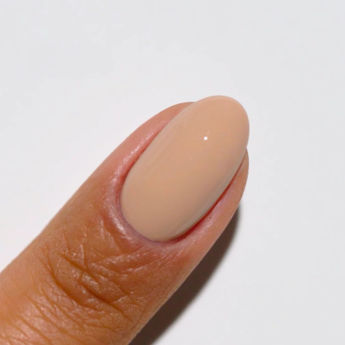 DND Diva Duo Gel & Polish Toasted 051 swatch showing a warm, nude gel nail polish and lacquer finish on nails.