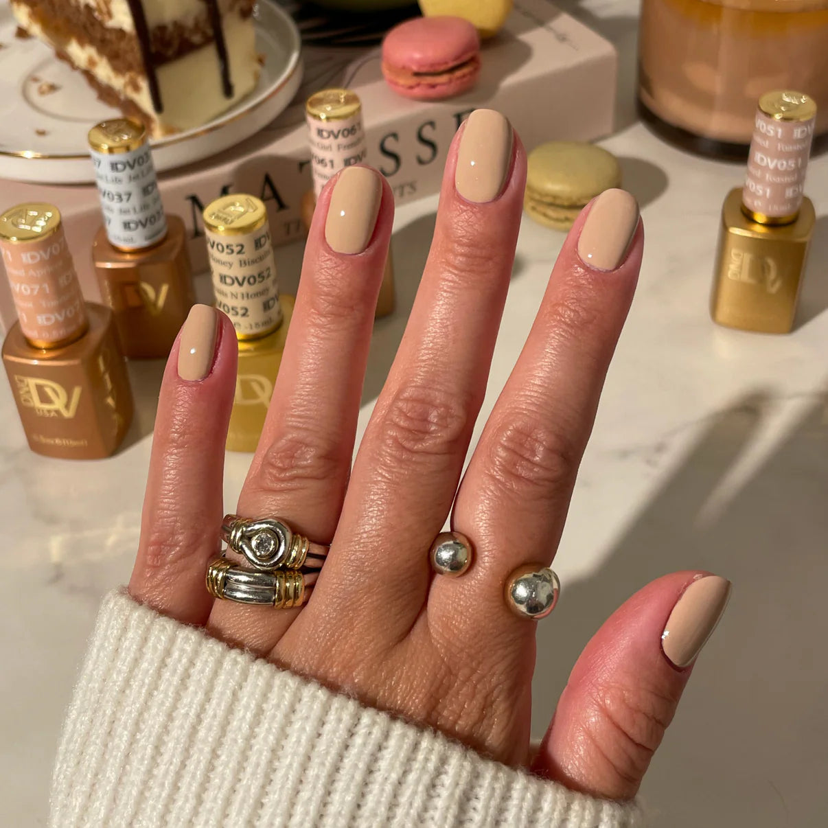 DND Diva Duo Gel & Polish Toasted 051 swatch showing a warm, neutral beige gel nail polish and lacquer finish.