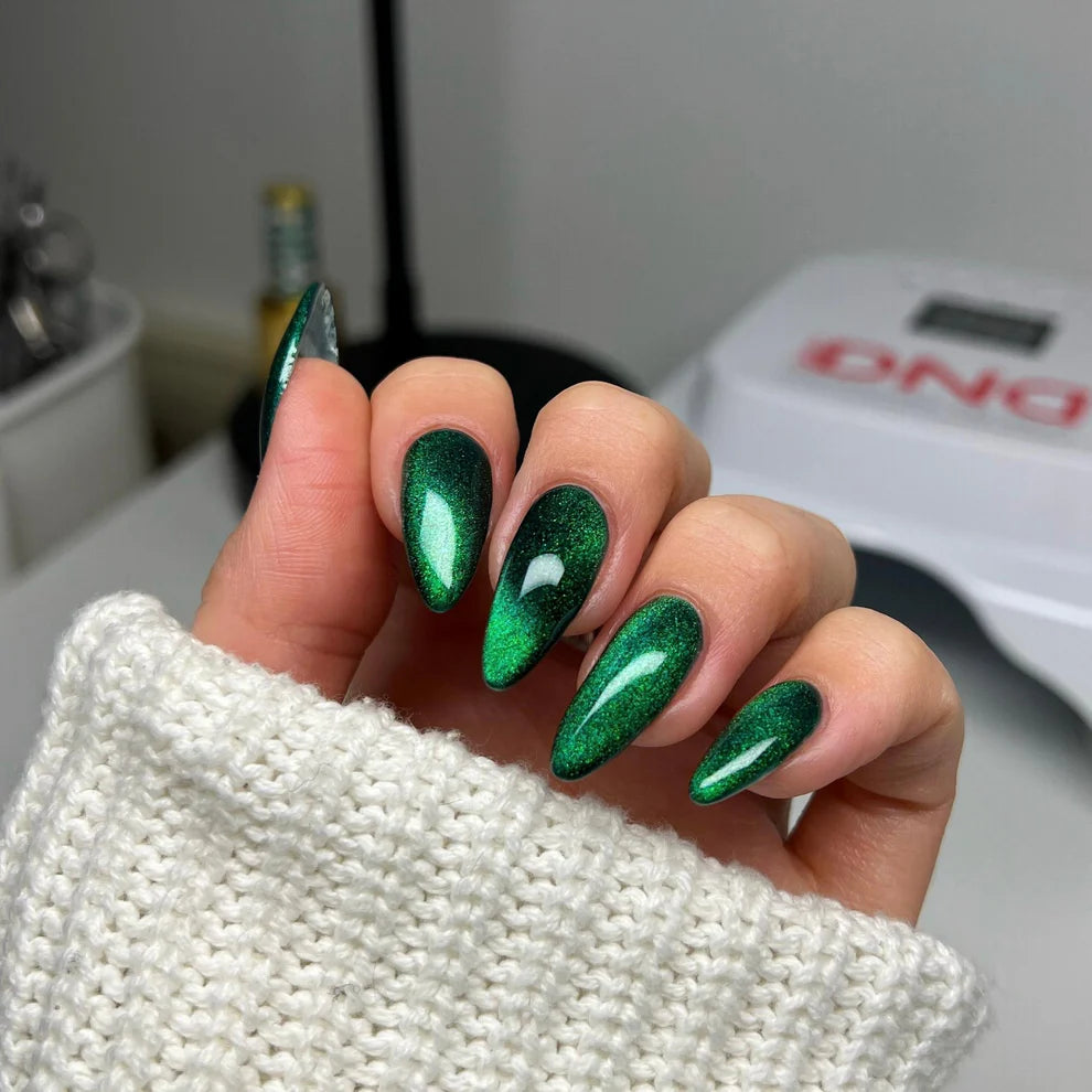 DND Diva 9D Cat Eye Gel Polish in Jungle Cat shade with glassball effect, featuring a vibrant green and gold cat eye finish.