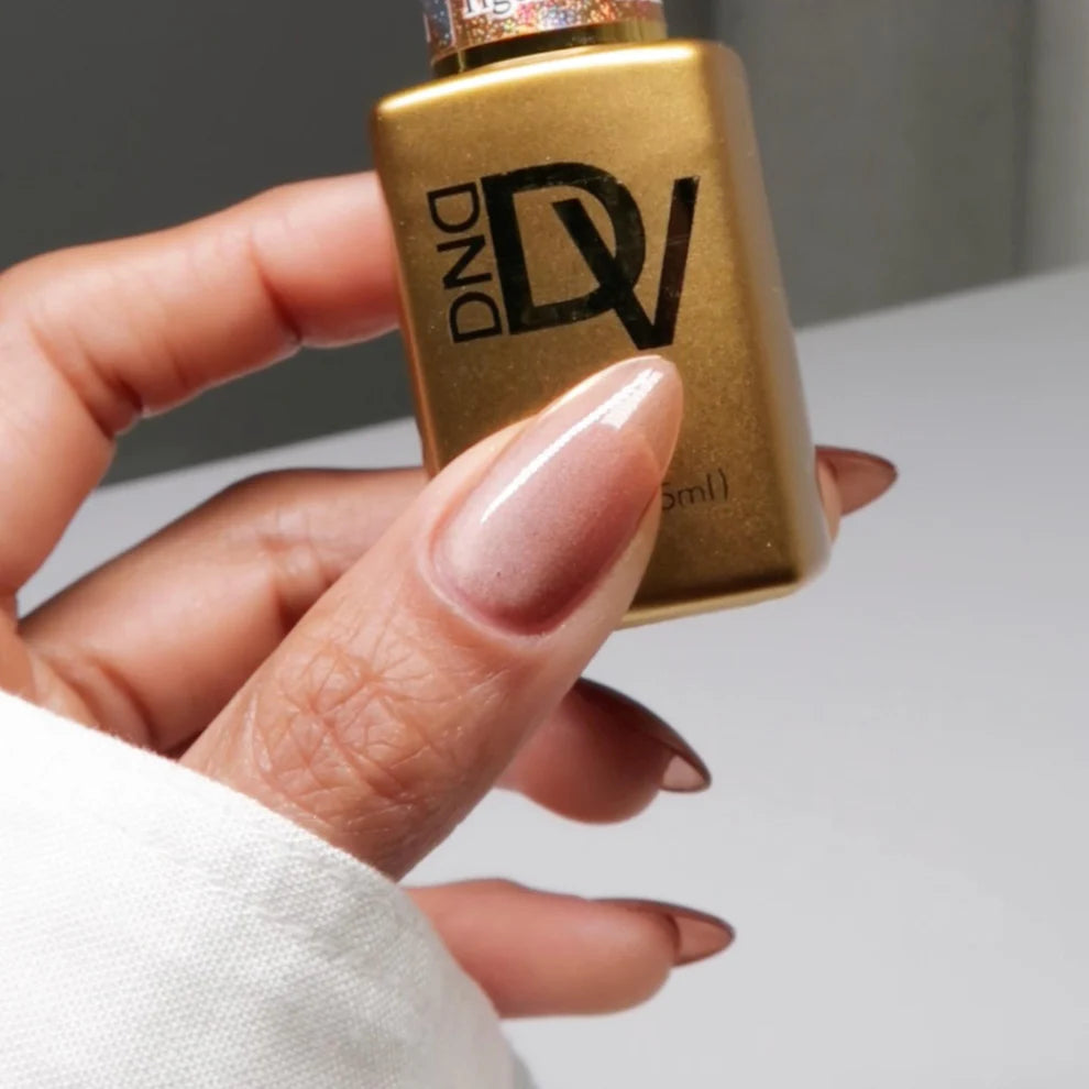 DND Diva 9D Cat Eye Gel Polish in shade Tiger Eyes with glassball effect, showcasing vibrant orange and gold hues with a shimmering finish.