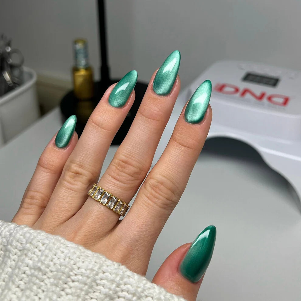 DND Diva 9D Cat Eye Gel Polish in Sea Glass shade showing the shimmering teal and blue color with glassball effect.