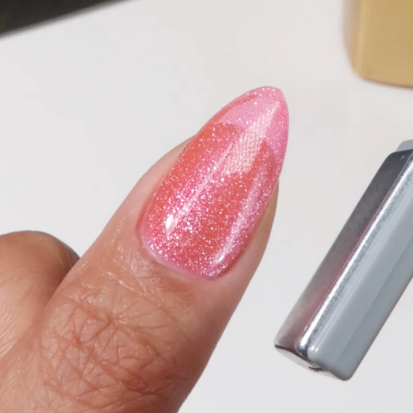 DND Diva 9D Cat Eye Gel Polish in Lollipop Pounce, featuring glassball effect and vibrant purple color with cat eye shimmer.