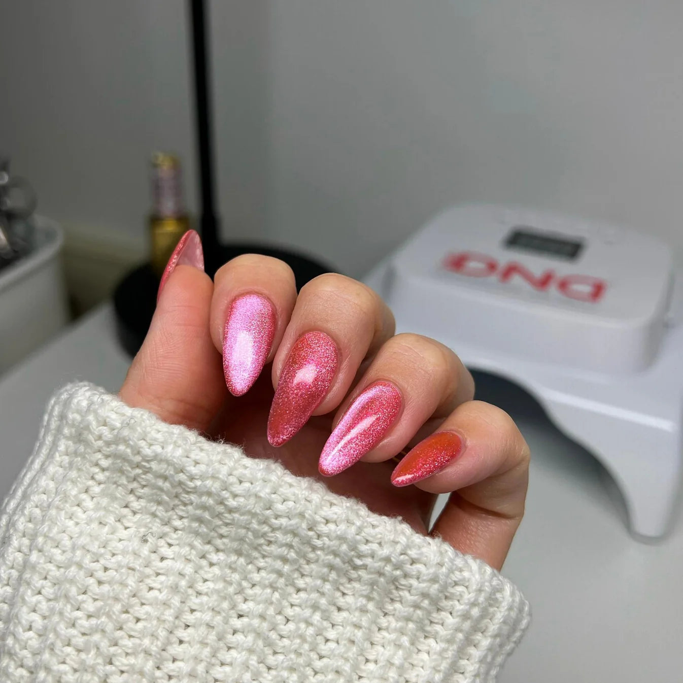 DND Diva 9D Cat Eye Gel Polish in Lollipop Pounce shade, featuring glassball finish and vibrant, shimmering cat eye effect.