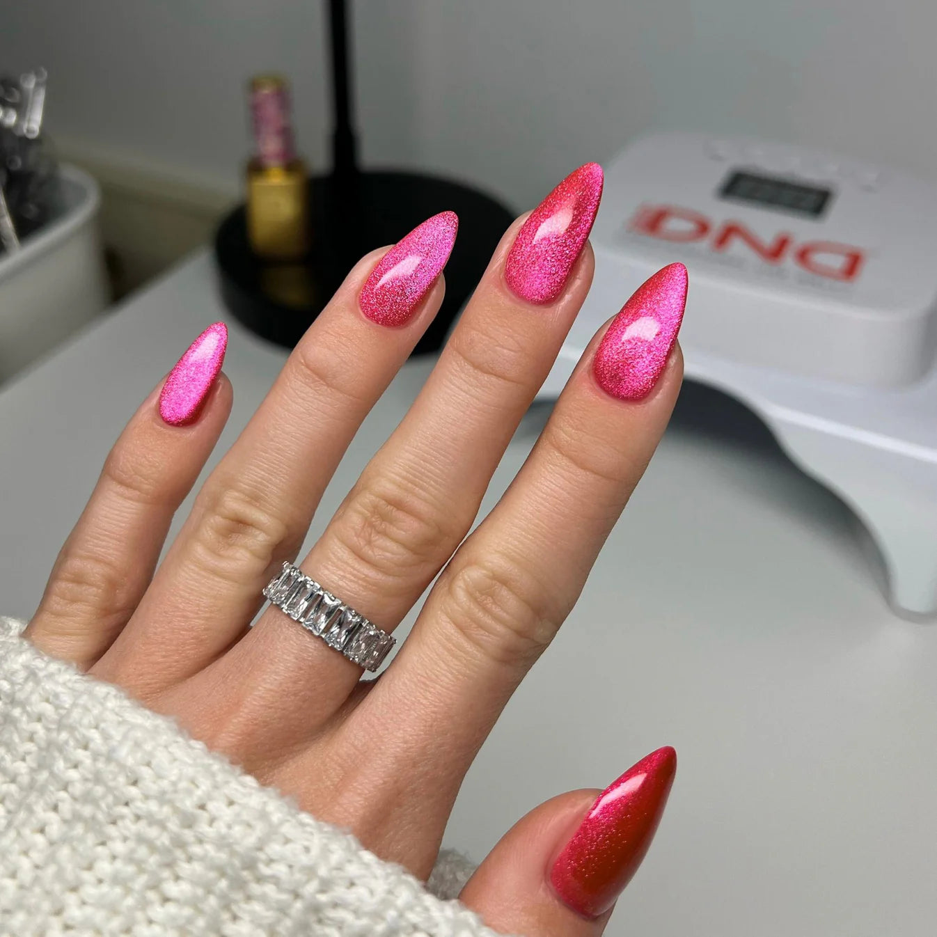 DND Diva 9D Cat Eye Gel Polish in Hi, Kitty! shade with glassball effect, featuring a vibrant, shimmering pink color.