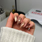 DND Diva 9D Cat Eye Gel Polish in Toffee Crisp, featuring a glassball finish and 9D magnetic effect on a nail display.