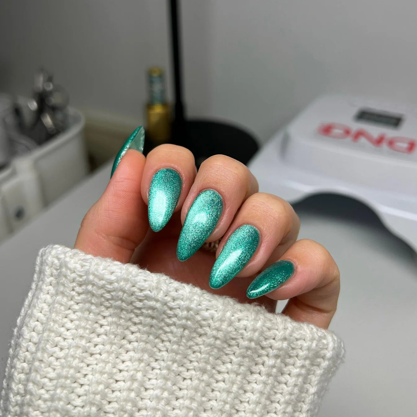 DND Diva 9D Cat Eye Gel Polish in Leopard Mint with glassball finish, showcasing vibrant green and black feline-inspired design.