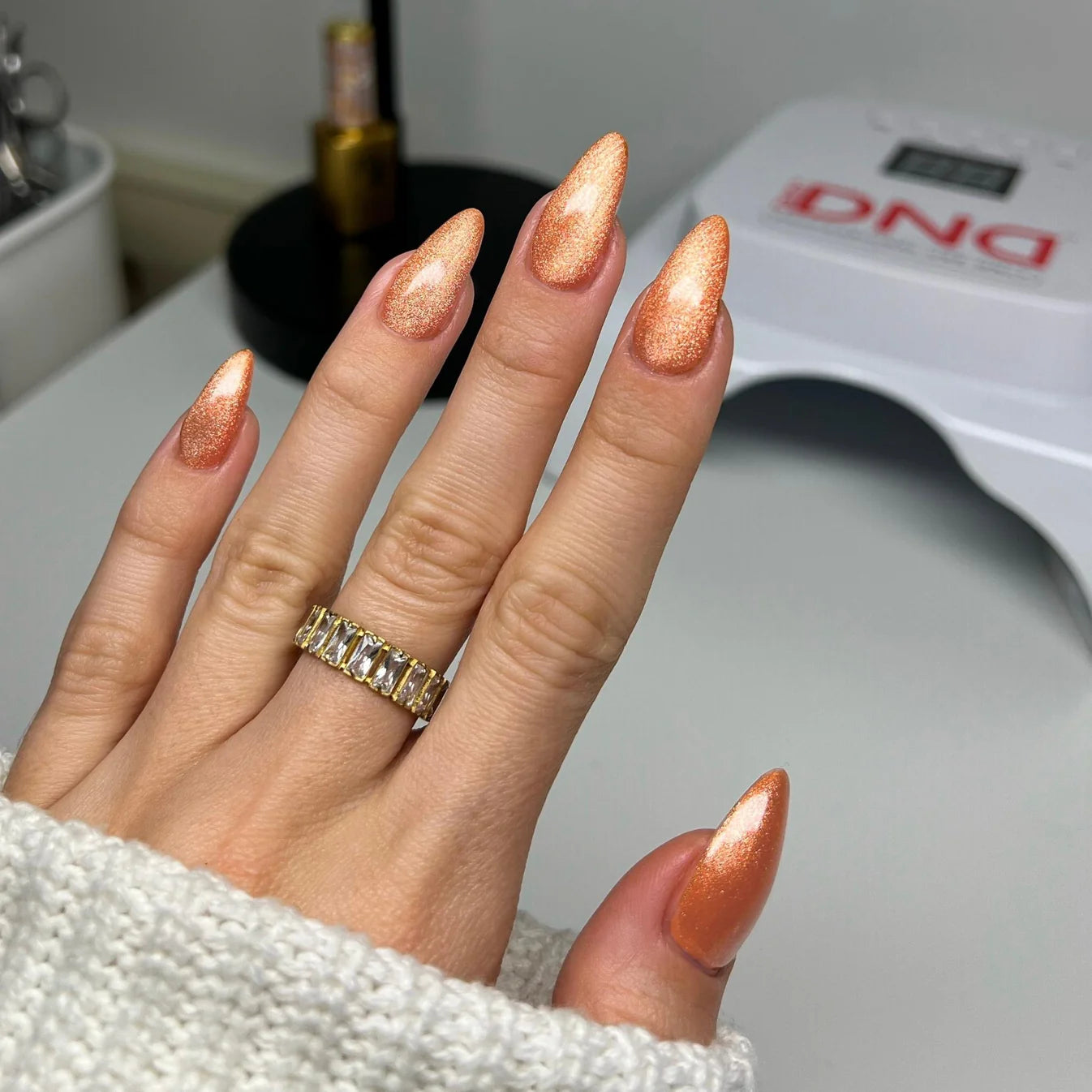 DND Diva 9D Cat Eye Gel Polish in Button Nose, featuring a glassball finish and vibrant purple color on a nail surface.