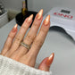 DND Diva 9D Cat Eye Gel Polish in Button Nose, featuring a glassball finish and vibrant purple color on a nail surface.