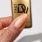 DND Diva 9D Cat Eye Gel Polish in Button Nose shade with glassball effects, showcasing vibrant color and glossy finish.