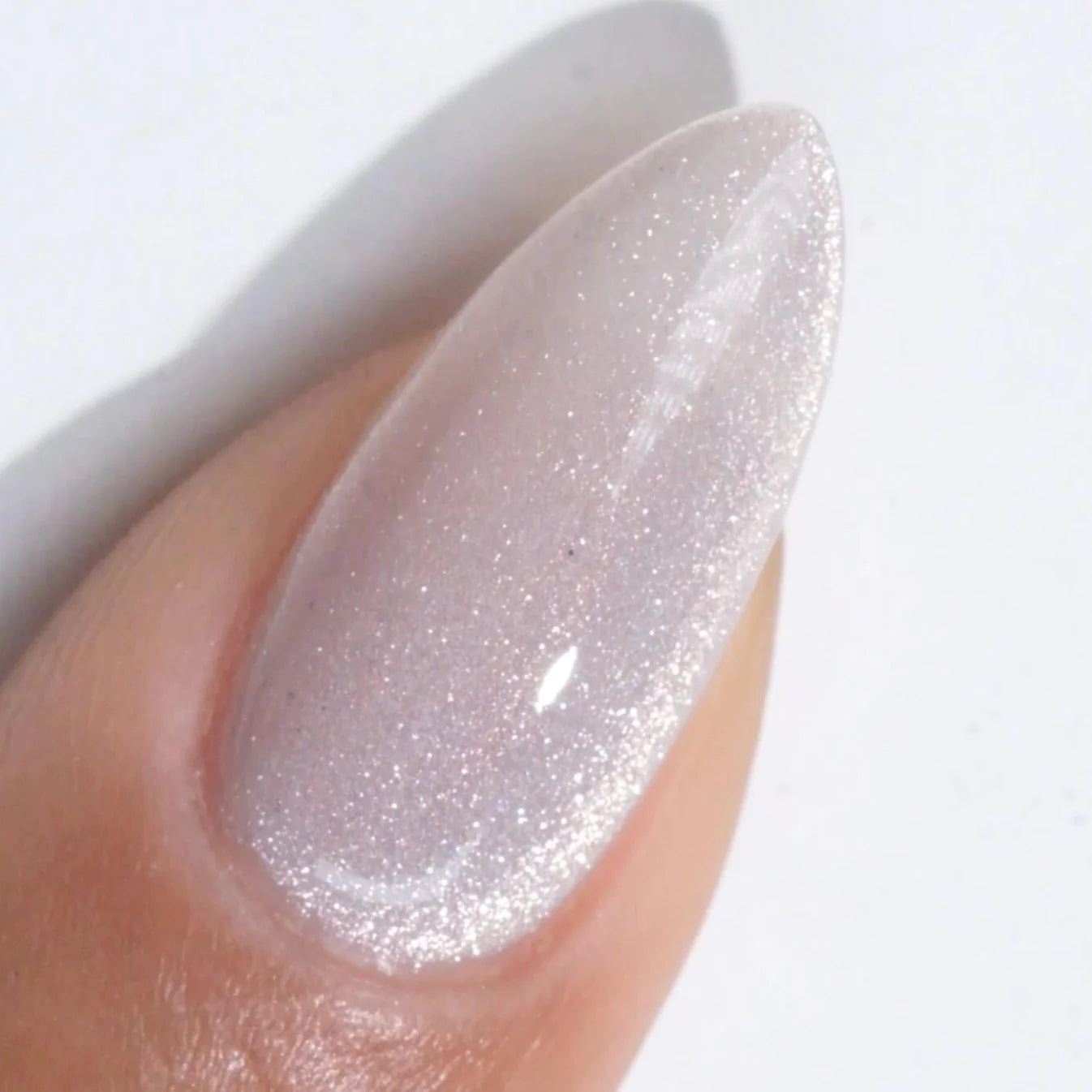 DND Diva 9D Cat Eye Gel Polish in Sun Patch shade with glassball effect, showcasing vibrant color and reflective finish.