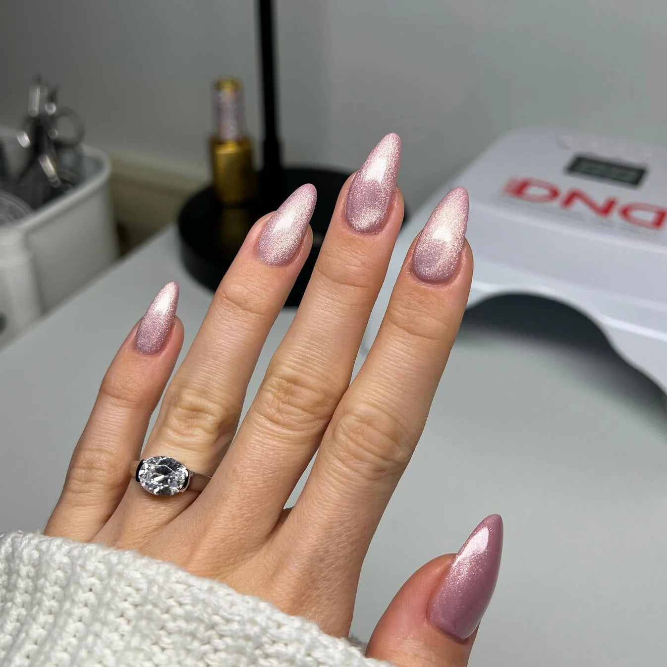 DND Diva Gel Polish 9D Cat Eye in shade Just Kitten, featuring a glassball finish with vibrant, shimmering purple color.