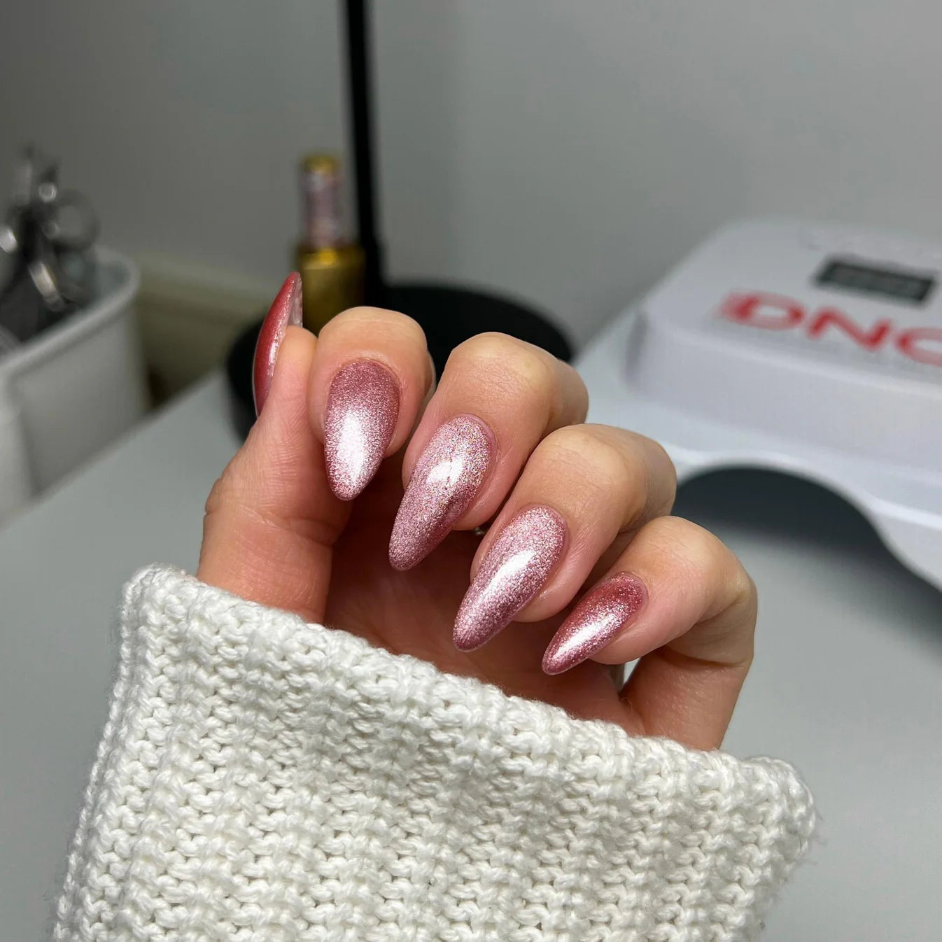 DND Diva 9D Cat Eye Gel Polish in shade Wanna Be Yours, featuring glassball shimmer and deep blue color, for stunning nail designs.