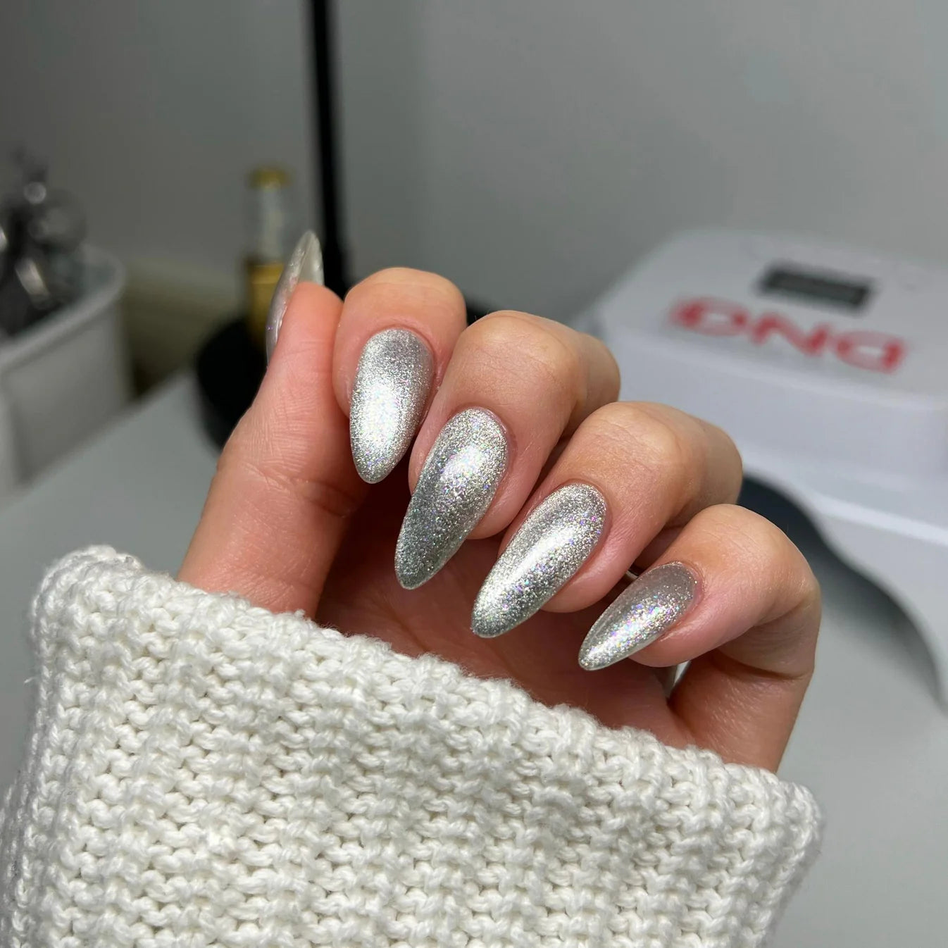 DND Diva 9D Cat Eye Gel Polish in shade #31 with glassball finish, showcasing vibrant, multi-dimensional nail art design.