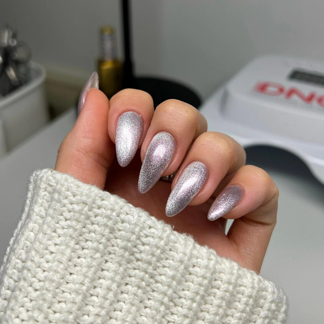 DND Diva Gel Polish 9D Cat Eye Glassball #32 in Catty Ever After, showcasing vibrant, shimmering cat eye nail polish with glassball effect.