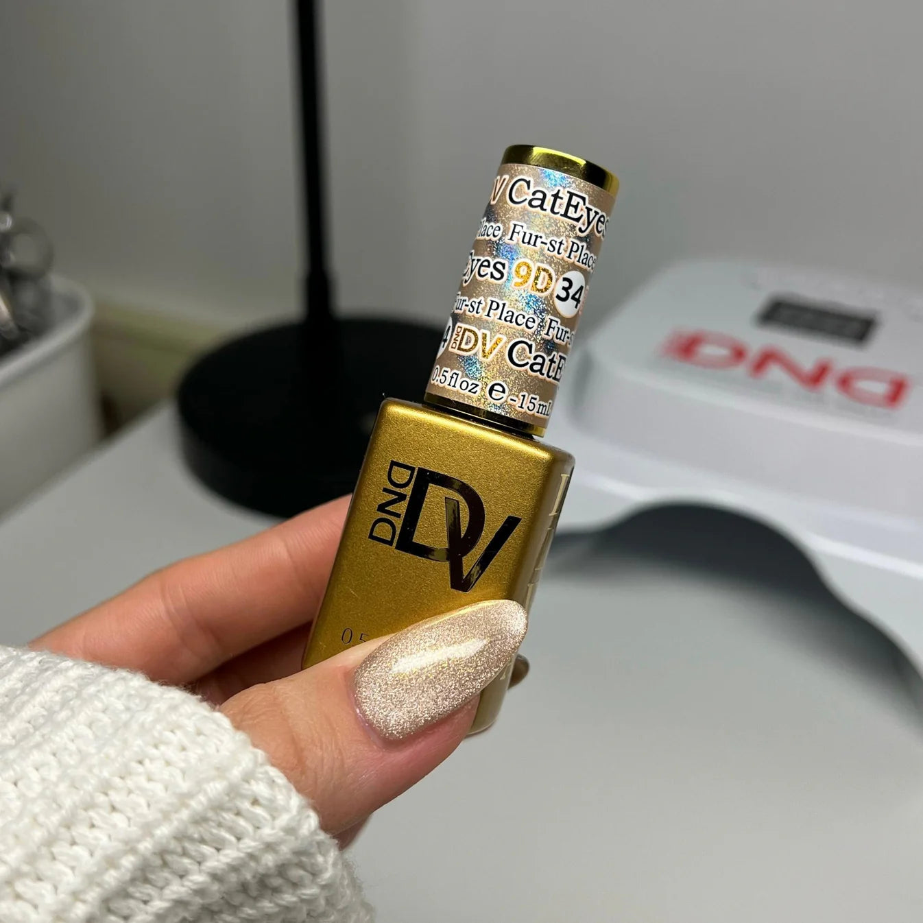 DND Diva 9D Cat Eye Gel Polish in shade Fur-st Place, featuring a glossy finish with 9D glassball effect and vibrant cat eye shimmer.