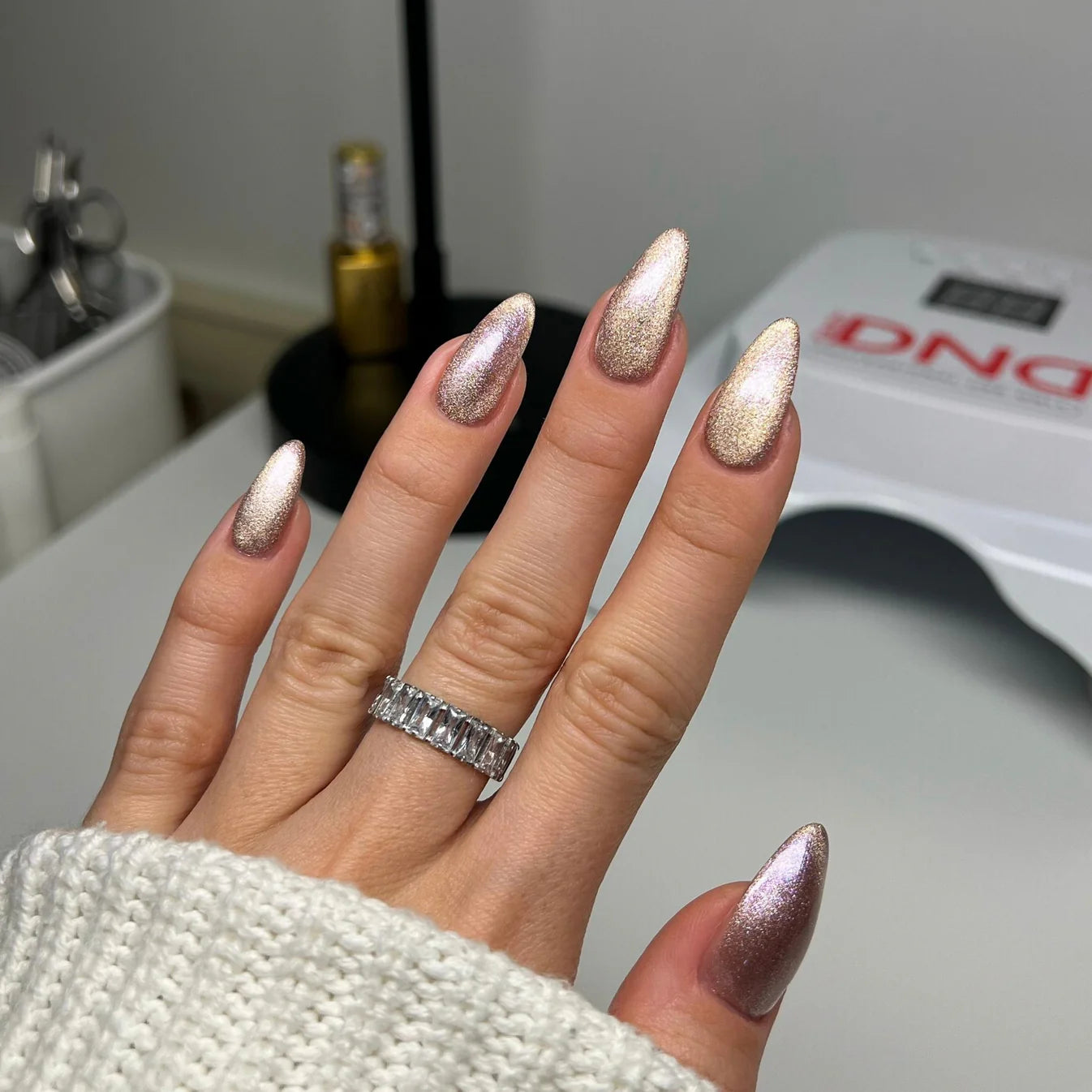 DND Diva 9D Cat Eye Gel Polish in Hazel Dreams with glassball effect, showcasing deep hazel color and shimmering finish.