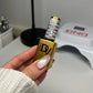 DND Diva 9D Cat Eye Gel Polish in Hazel Dreams, featuring a glassball finish and 9D holographic effect with a rich hazel color.