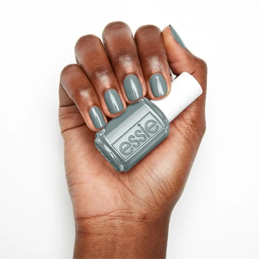 Essie Nail Lacquer in Caught In The Rain, a glossy blue-green nail polish bottle with the cap on.