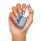 Essie A to Zzz nail lacquer bottle with purple cap and clear label, showcasing the colorful nail polish inside.