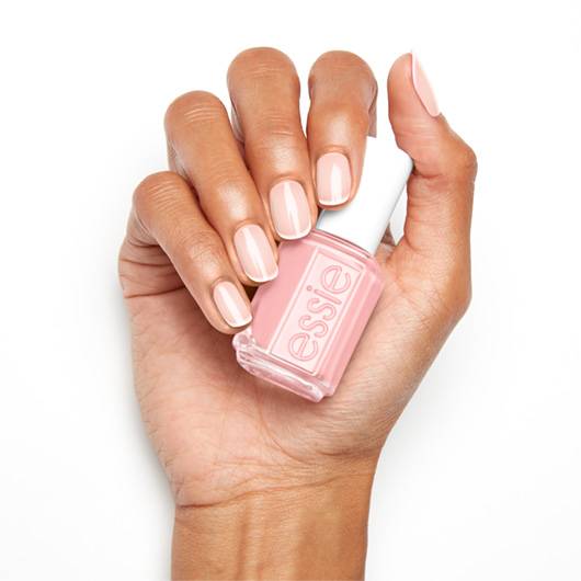Essie Nail Lacquer in Hi Maintenance #100, a vibrant nail polish bottle with the Essie logo and bright pink shade visible.