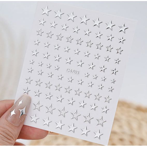 Silver nail art decoration stickers with five 3D mixed shape designs for creative manicure embellishments.