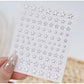 Silver nail art decoration stickers with five 3D mixed shape designs for creative manicure embellishments.