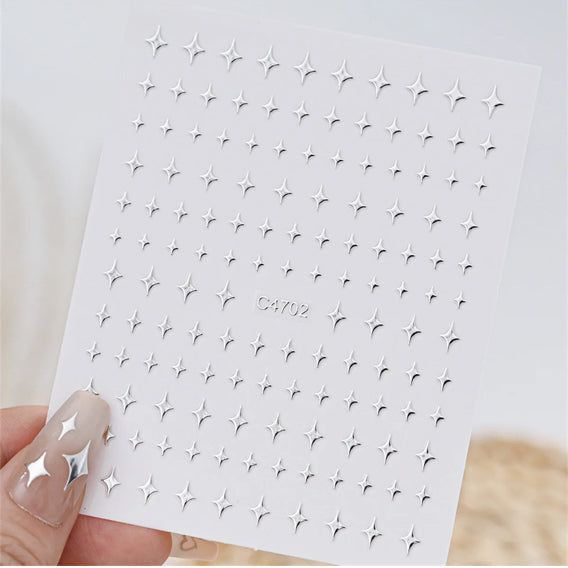 Silver nail art decoration stickers with five 3D mix shape designs for creative nail enhancements by UNS.