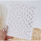 Silver 3D mix shape nail art decoration stickers by UNS, featuring five pieces of intricate nail art embellishments.