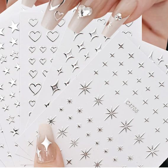 Silver 3D mix shape nail art decoration stickers by UNS, featuring five pieces of intricate nail design embellishments.