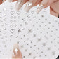 Silver 3D mix shape nail art decoration stickers by UNS, featuring five pieces of intricate nail design embellishments.