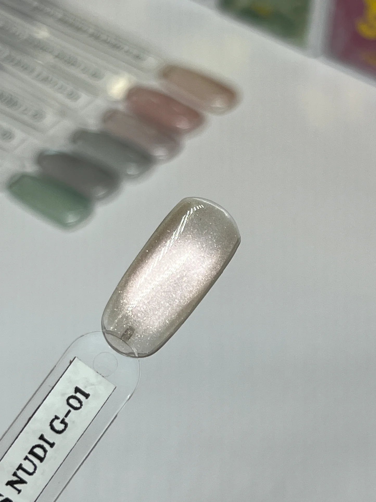Sofi Art Gellicure Pro Cat Eye Gel in Nudi G-01 with glass bead finish, for professional gel nail art and stunning cat eye effects.