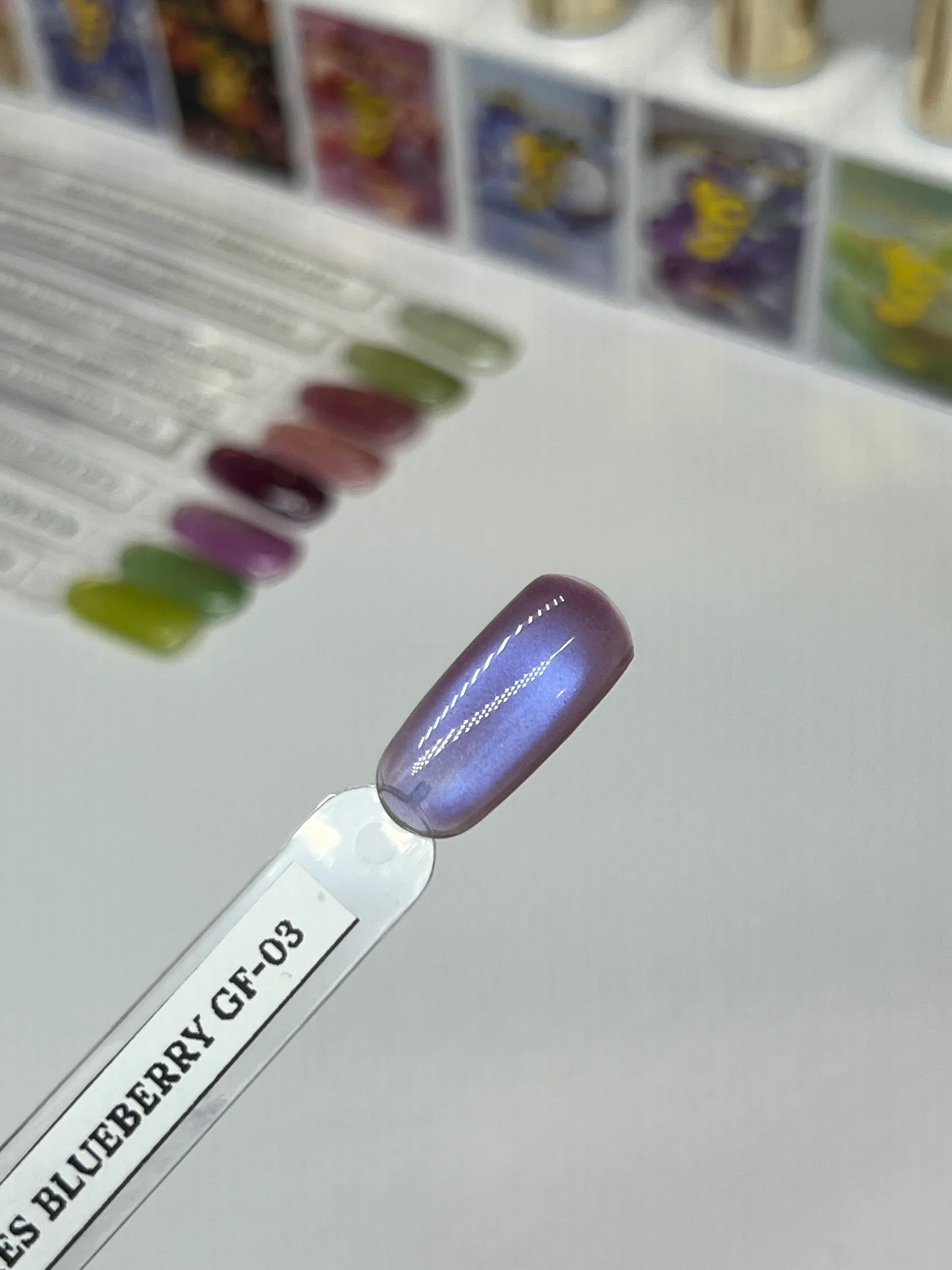 Sofi Art Gellicure Pro Cat Eye Gel in Juicy Fruit Blueberry GF-03, vibrant blue gel with cat eye effect and glossy finish.