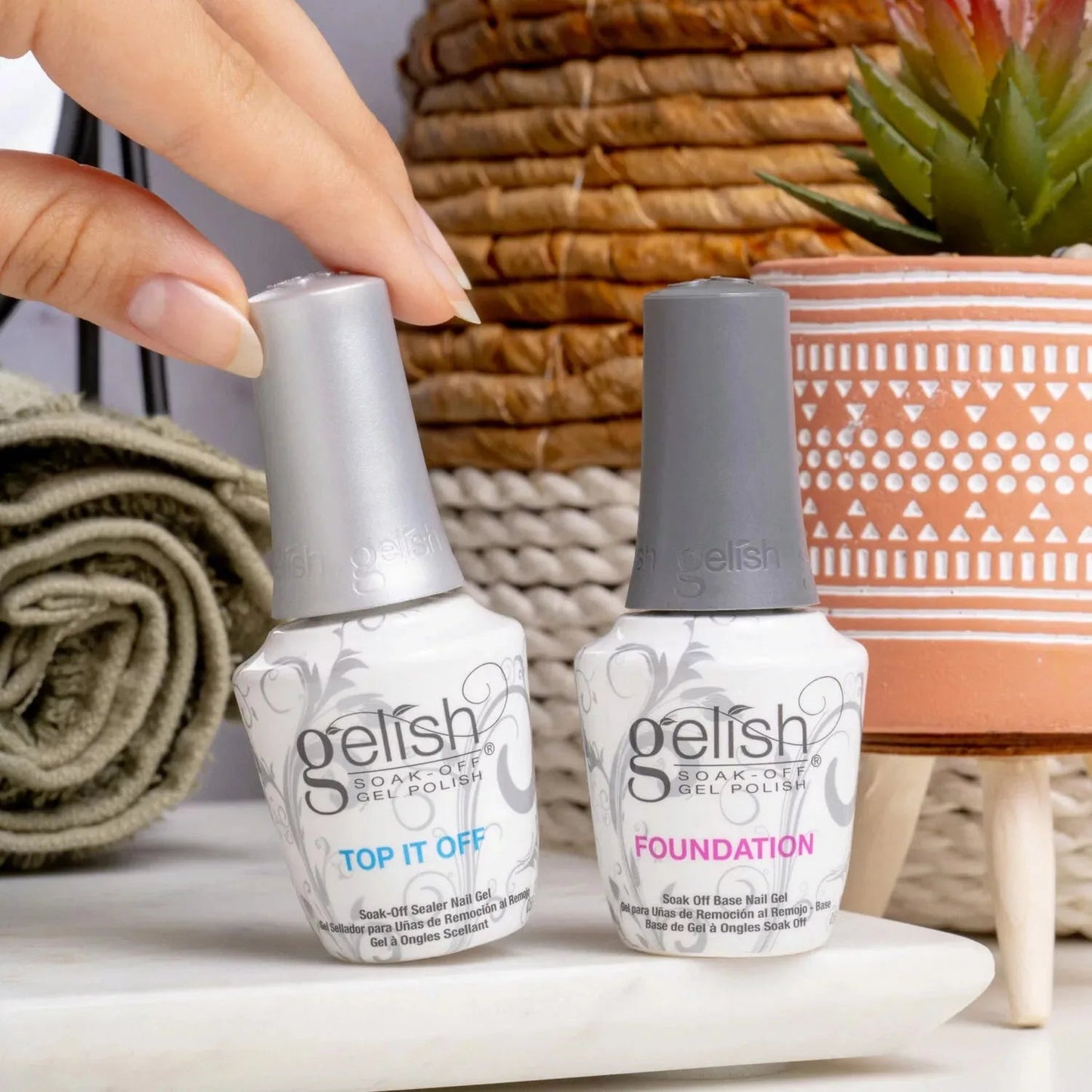 Harmony Gelish gel nail polish foundation and top coat duo, showing the bottles with pink and clear labels, on a white background.