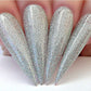 Kiara Sky Gel Polish Feelin Nutty #G561, clear gel nail polish bottle with purple and gold accents on the label.