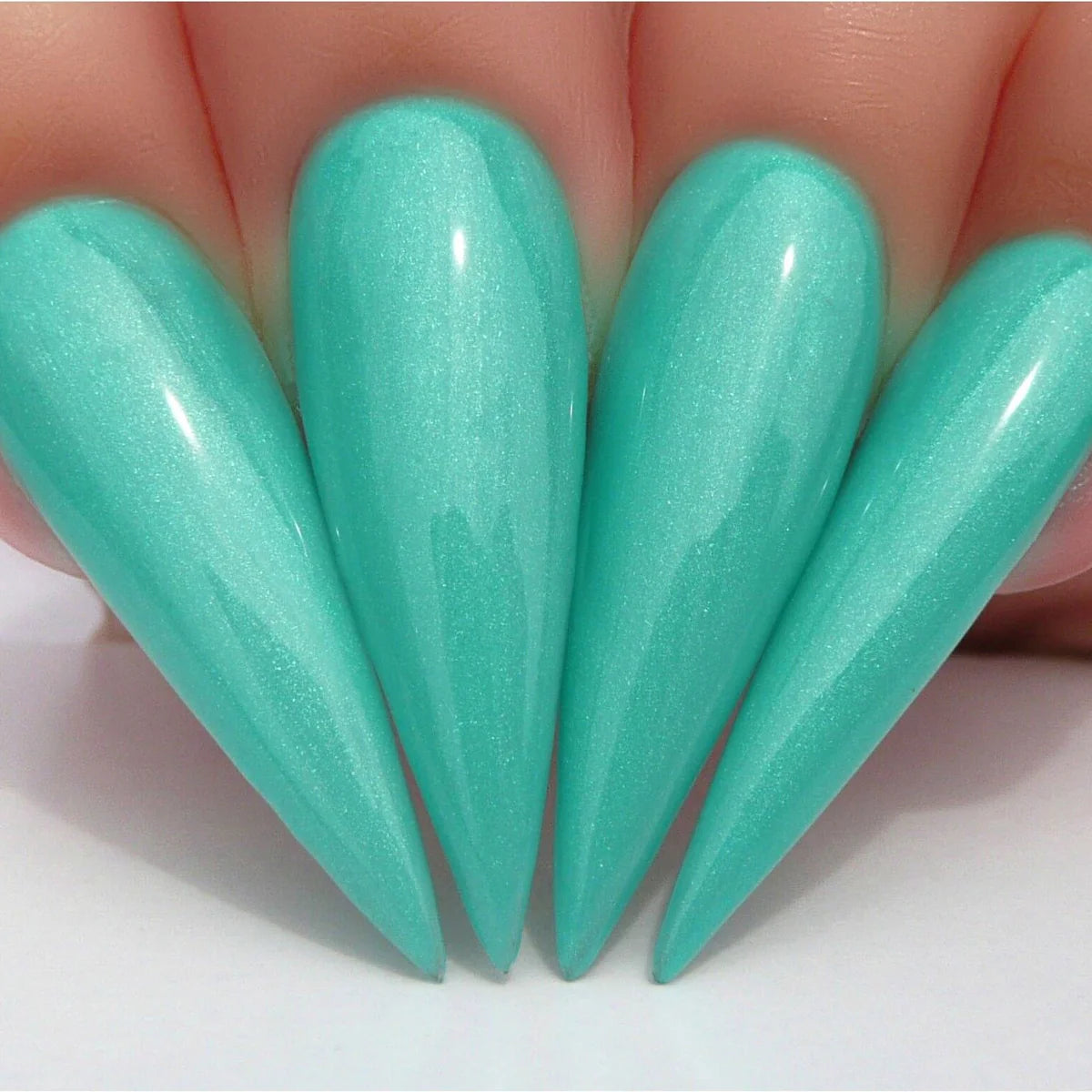 Close-up of a clear Kiara Sky Gel Nail Polish bottle labeled Shake Your Palm Palm #G588, with a soft pink background.