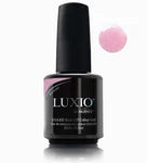 Luxio soak-off gel polish in a 15ml bouquet bottle, showcasing vibrant color and smooth, glossy finish on a nail.