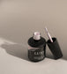 Open bottle of Luxio Soak-Off Gel Polish in 15ml size, showcasing the sleek black and clear design of the Luxio gel polish bottle.