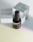 Luxio Aura soak-off gel polish in iridescent shade, 15ml bottle, showcasing the shimmering, color-changing effect on nails.