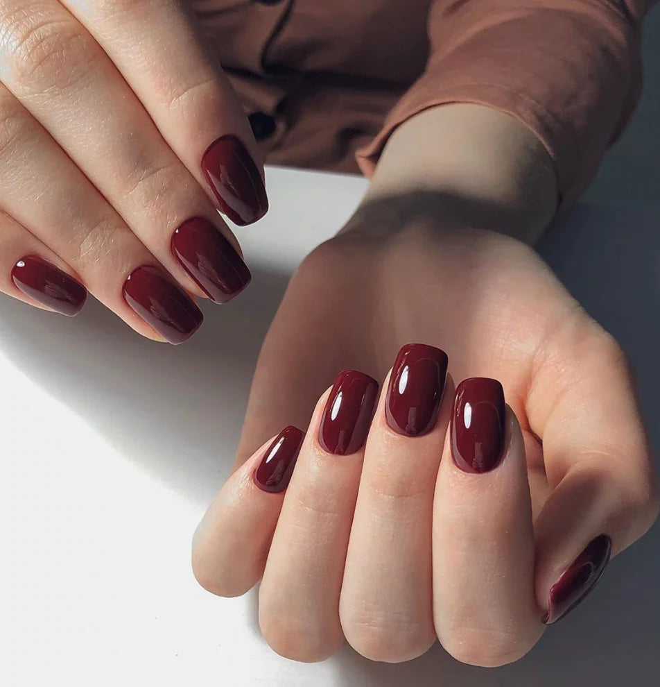 Luxio Soak-Off Gel Polish in Beguiling 15ml bottle, showcasing the elegant dark purple gel color and branding on the container