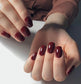 Luxio Soak-Off Gel Polish in Beguiling 15ml bottle, showcasing the elegant dark purple gel color and branding on the container