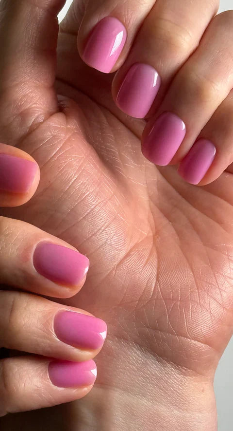 Luxio Blossom soak-off gel polish in 15ml bottle, showcasing soft pink tint and smooth gel texture for professional manicures.