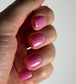 Luxio Soak-Off Gel Polish in Blossom tint, sheer pink color, 15ml bottle, showing the gel polish on a nail tip.