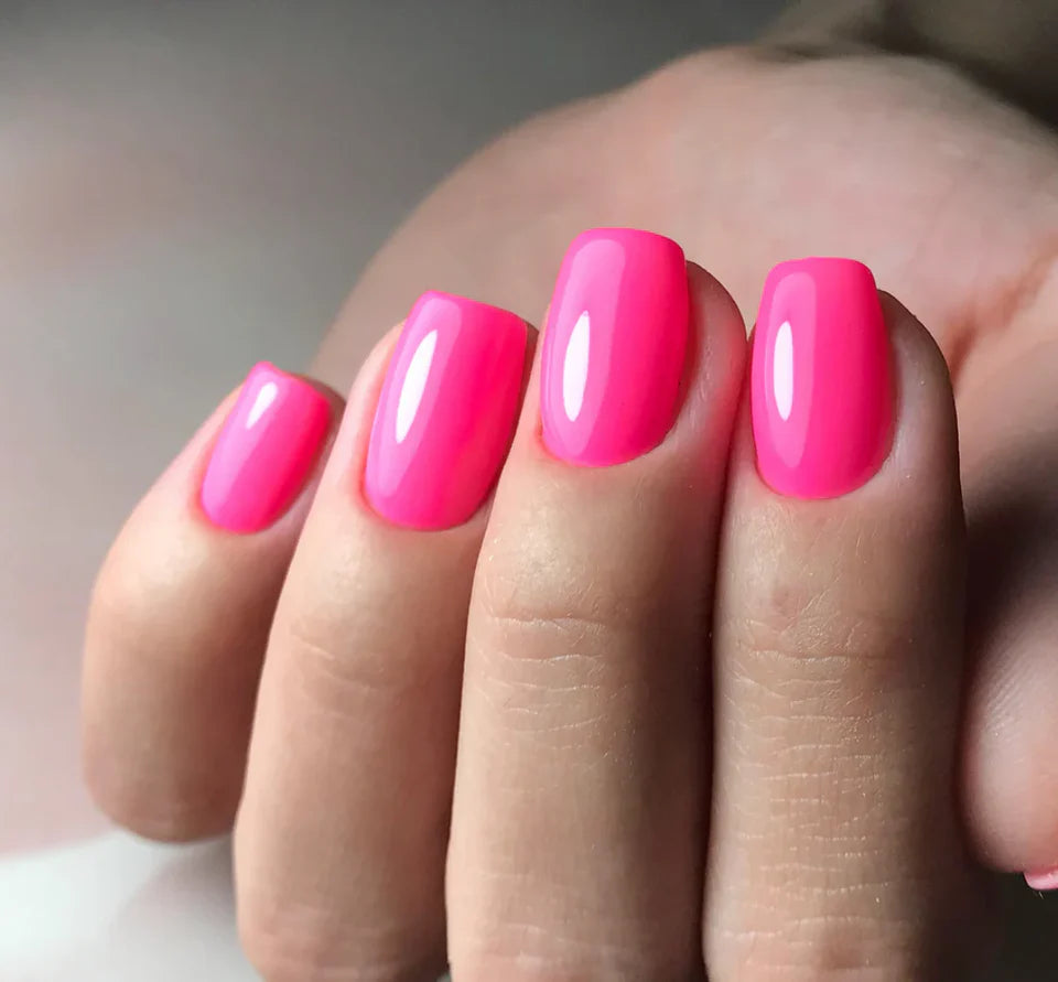 Luxio Soak-Off Gel Polish in Bombshell Bright, 15ml, vibrant orchid color with glossy finish on a nail.