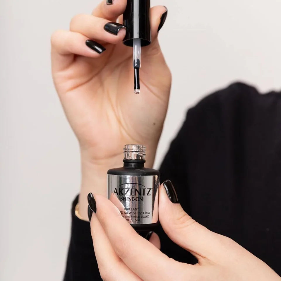 Luxio Gel Polish Shine-On Tack-Free Top Coat applied on nails, showcasing a brilliant glossy finish and smooth, even surface.