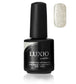 Luxio Soak-Off Gel Polish Champagne Sparkle 15ml bottle showing the shimmering, light champagne-colored gel polish with glitter accents