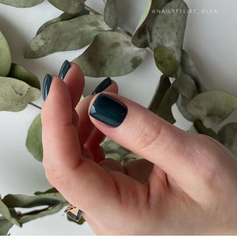 Luxio soak-off gel polish in Cypress 15ml bottle, showing the dark green gel with smooth, glossy finish.