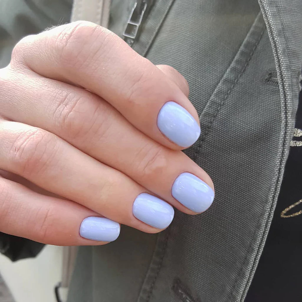 Luxio Soak-Off Gel Polish Daring 15ml bottle with black cap and vibrant orange color, showcasing the Luxio brand gel polish product.