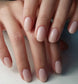 Luxio Soak-Off Gel Polish Demure sheer 15ml bottle with pink cap and label, showcasing Luxio brand gel polish product.