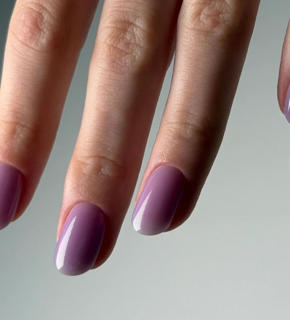 Luxio Soak-Off Gel Polish in Freesia tint, 15ml bottle, showcasing the vibrant, floral nail polish color in a clear glass bottle