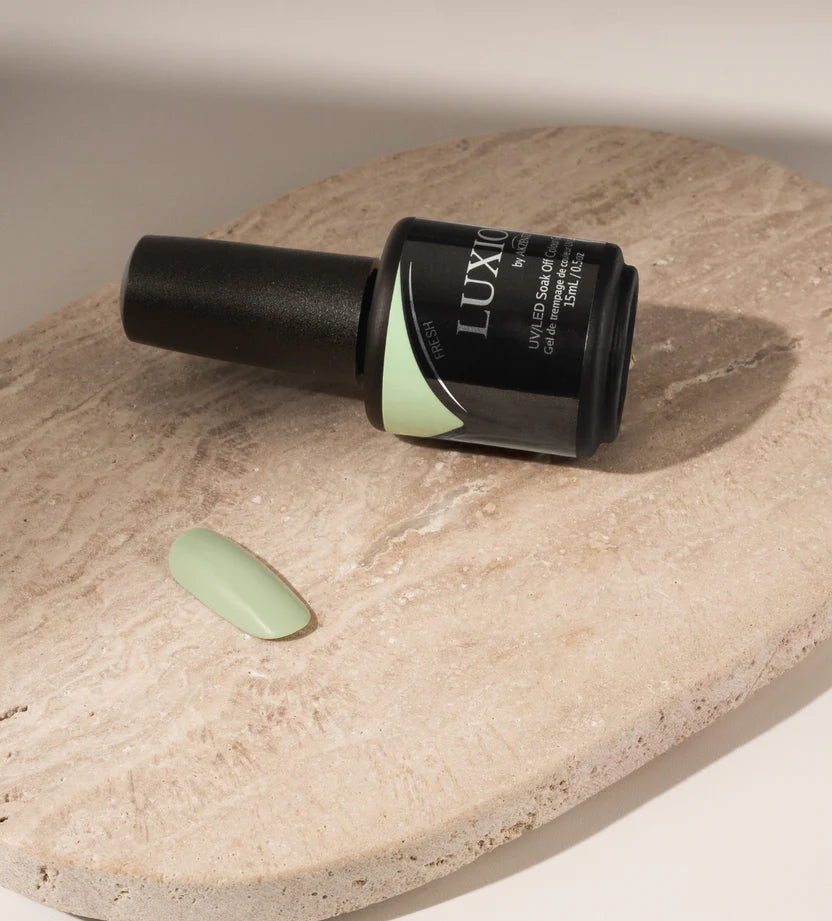 Luxio Soak-Off Gel Polish in Fresh 15ml bottle, featuring a clear cap and vibrant label, displayed with a chip on the bottle.